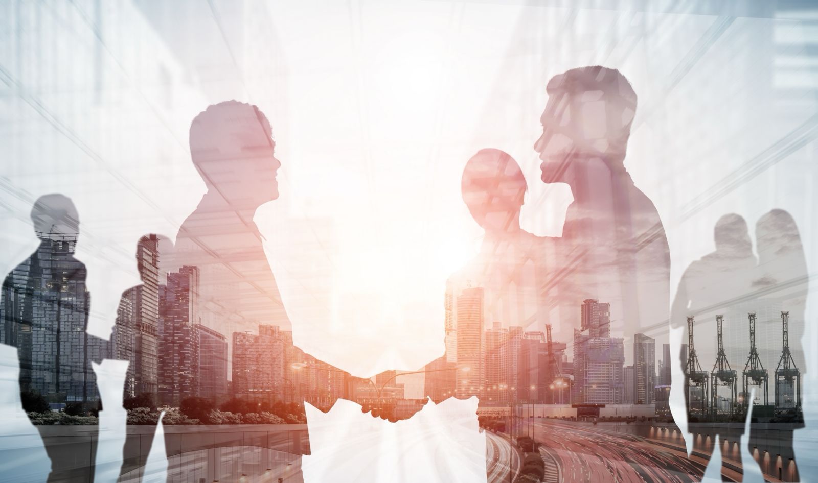 A partnership handshake over the city